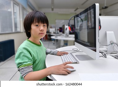 Asian School Boy Having Computer Class