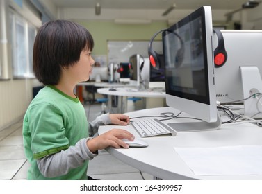 Asian School Boy Having Computer Class