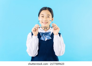 Asian Schoolgirl Wearing Eye Glasses With School Uniform.