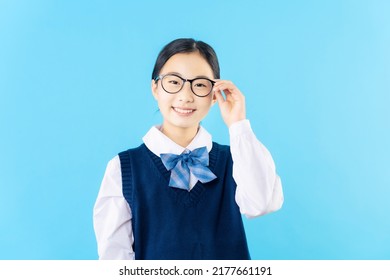 Asian Schoolgirl Wearing Eye Glasses With School Uniform.