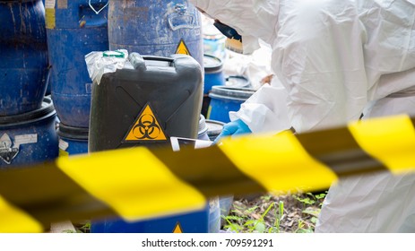 Asian scientist wear Chemical protection suit check danger chemical,working at dangerous zone,authenticating the dangerous chemicals