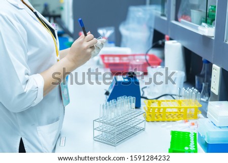 Asian scientist working in the lab,Doing experiment for product,The researchers analyzed to find the results of the experiment.