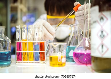 Asian scientists are experimenting with chemistry in the laboratory.