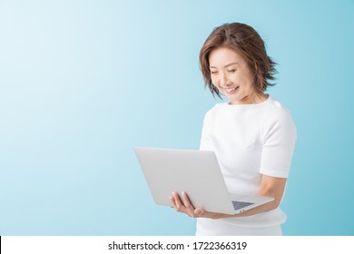 Asian Senior Age Woman Using Laptop