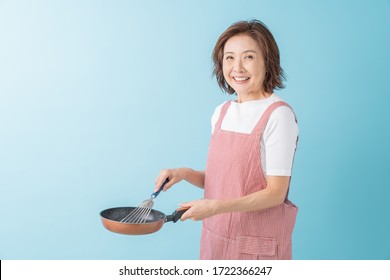 Asian Senior Age Woman Who Cooks