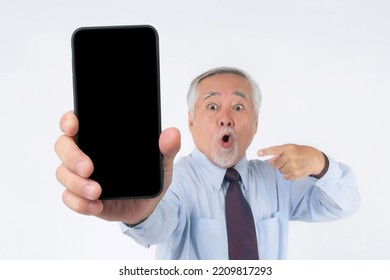 Asian Senior Businessman , Old Man Feel Happy Good Health , Excited Surprised Face Showing Big Smart Phone With Blank Screen , Black Screen Isolated On White Background , Mock Up Image