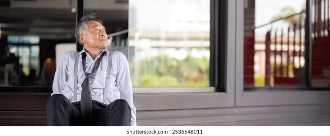 Asian senior businessman sitting on steps thoughtful with stress and frustrated in modern office, elderly business man contemplative to problem with sad and anxious, business and emotion. - Powered by Shutterstock