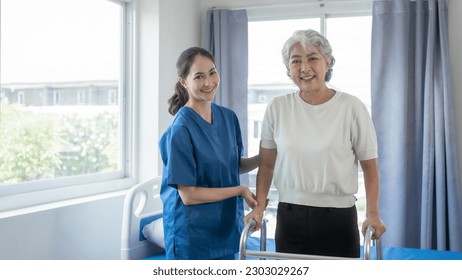 Asian senior care nurses and grandmothers provide caring support to elderly women hand clasp to encourage exercising with elder disabled person patient with caregiver in nursing care. - Powered by Shutterstock