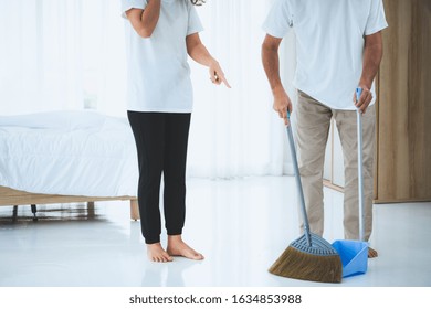 Asian Senior Couple Cleaning Bedroom Floor. Retirement And Healthy Elderly Concept.