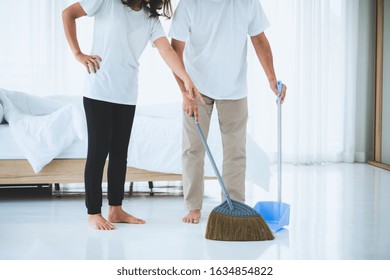 Asian Senior Couple Cleaning Bedroom Floor. Retirement And Healthy Elderly Concept.