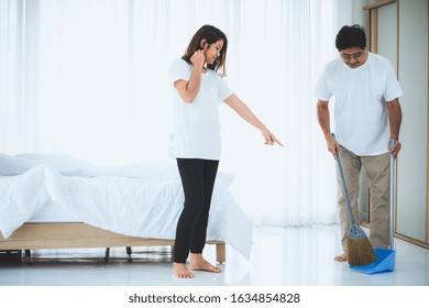 Asian Senior Couple Cleaning Bedroom Floor. Retirement And Healthy Elderly Concept.