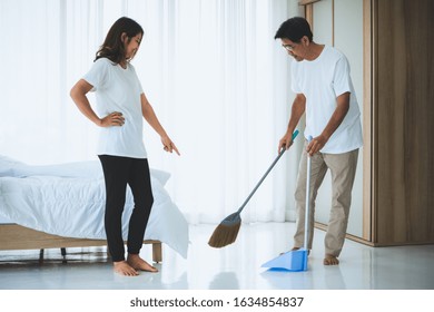 Asian Senior Couple Cleaning Bedroom Floor. Retirement And Healthy Elderly Concept.