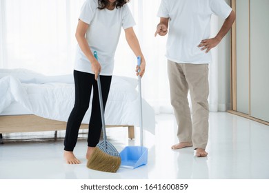 Asian Senior Couple Cleaning Bedroom Floor. Retirement And Healthy Elderly Concept.