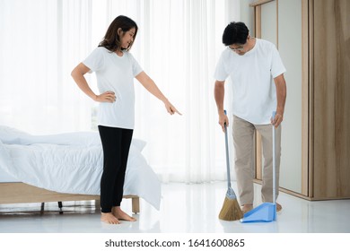 Asian Senior Couple Cleaning Bedroom Floor. Retirement And Healthy Elderly Concept.