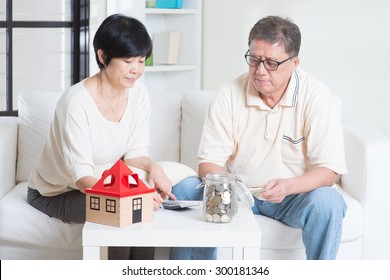 Asian Senior Couple Counting On Money. Saving, Retirement Plan, Retirees Financial Planning Concept. Family Living Lifestyle At Home.