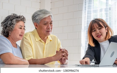 Asian senior couple with financial advisor about tax and retirement document at home.happy aging at home concept.