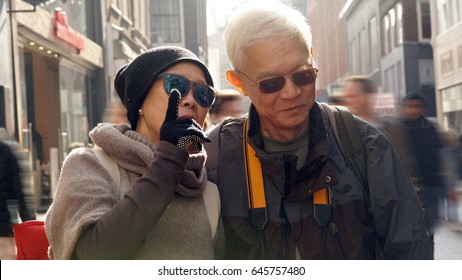 Asian Senior Couple Having Fun In Europe Retirement Anniversary Trip Together