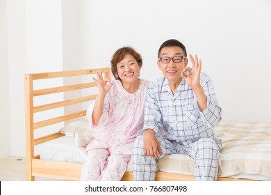 Asian Senior Couple In Night Clothes