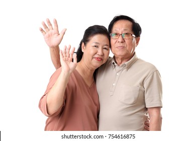 The Asian Senior Couple On The White Background.