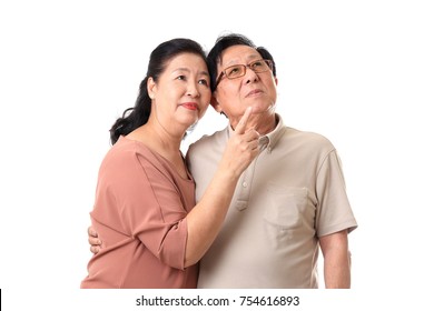 The Asian Senior Couple On The White Background.