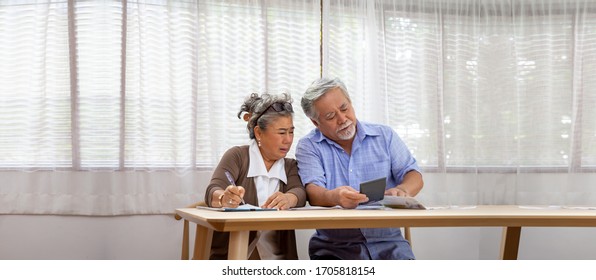 Asian Senior Couple Serious Worried With Calculating Bills To Pay Per Month Or Debt, Retired Elderly Reading Loan Document, Money Problems Concept