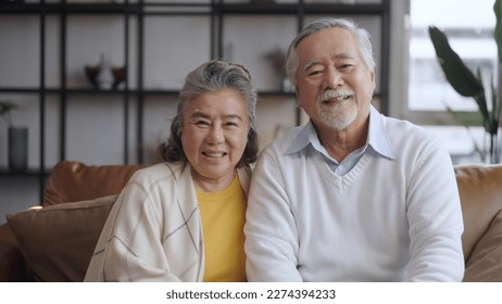 Asian senior couple smiling at the camera. Family mature couple portrait - Powered by Shutterstock