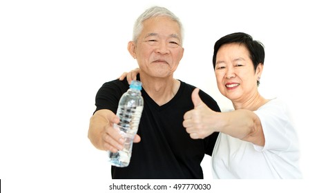 Asian Senior couple with water bottle stay hydrated for health - Powered by Shutterstock