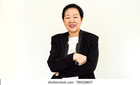 Asian senior elder woman wearing suit with happy face and hand gesture