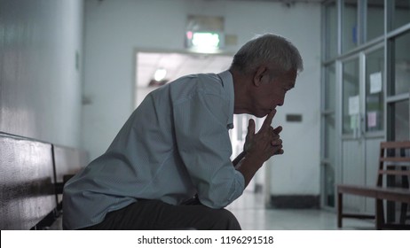 Asian senior elderly man worry about health medication at hospital - Powered by Shutterstock