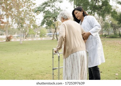 Asian Senior Or Elderly Old Lady Woman Patient Walk With Walker In Park : Healthy Strong Medical Concept 