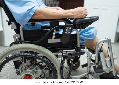 Asian senior or elderly old lady woman patient on electric wheelchair with remote control at nursing hospital ward, healthy strong medical concept  - Shutterstock ID 1787312270