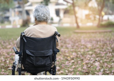 Asian Senior Or Elderly Old Lady Woman Patient On Wheelchair In Park, Healthy Strong Medical Concept. 