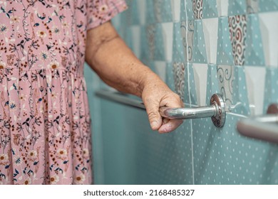 Asian senior or elderly old lady woman patient use toilet bathroom handle security in nursing hospital ward, healthy strong medical concept. - Powered by Shutterstock