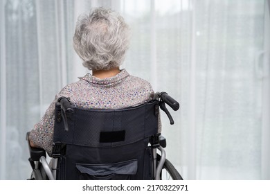 Asian senior or elderly old lady woman patient sitting on wheelchair at nursing hospital ward, healthy strong medical concept