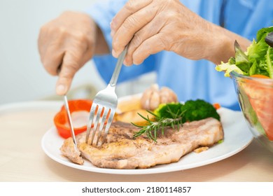 Asian Senior Or Elderly Old Lady Woman Patient Eating Breakfast And Vegetable Healthy Food With Hope And Happy While Sitting And Hungry On Bed In Hospital.