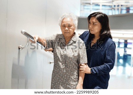 Asian senior or elderly old lady woman patient use slope walkway handle security with help support assistant in nursing hospital ward, healthy strong medical concept.
