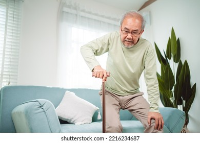 Asian Senior elderly old man disabled patient walking slowly his use walker or cane in living room at home. Feeling painful and suffering from knee pain. Healthcare medical and insurance concept
 - Powered by Shutterstock