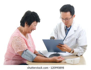 Asian Senior Female Medical Checkup With Doctor ,south East Asian Chinese Ethnicity