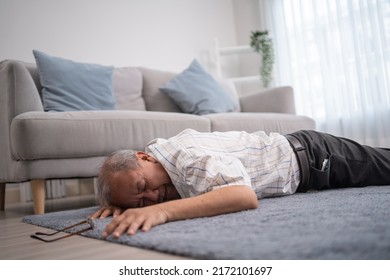 Asian senior grandfather fainting and falling on the ground in the living room. Elderly male patient having an accident or heart attack. home nursing and health insurance concept - Shutterstock ID 2172101697