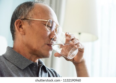 Asian Senior Man Drink Water From Glass. Good Health, Lifestyle.