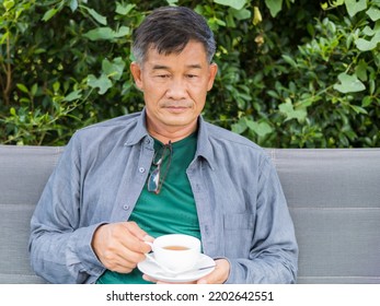 Asian senior man drinking tea in garden. senior lifestyle concept. - Powered by Shutterstock