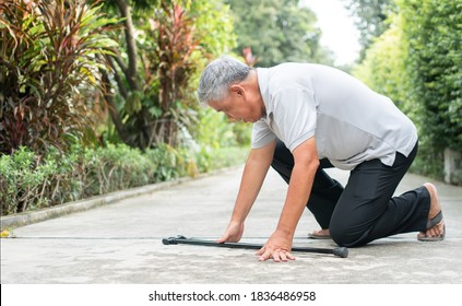 Asian Senior Man Falling Down At Home In The Backyard Caused By Myasthenia (Muscle Weakness) And The Nurse Came To Help Support. Concept Of Old Elderly Insurance And Health Care