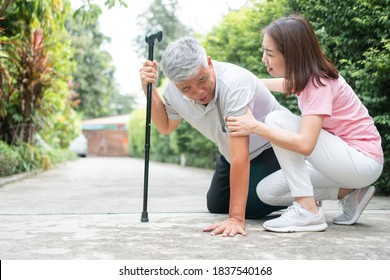 Asian Senior Man Falling Down At Home In The Backyard Caused By Myasthenia (Muscle Weakness) And The Nurse Came To Help Support. Concept Of Old Elderly Insurance And Health Care