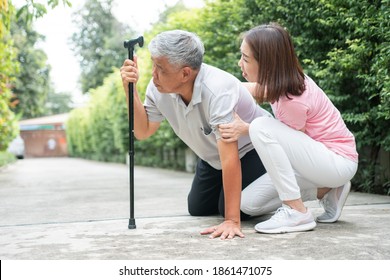 Asian Senior Man Falling Down At Home In The Backyard Caused By Myasthenia (Muscle Weakness) And The Nurse Came To Help Support. Concept Of Old Elderly Insurance And Health Care