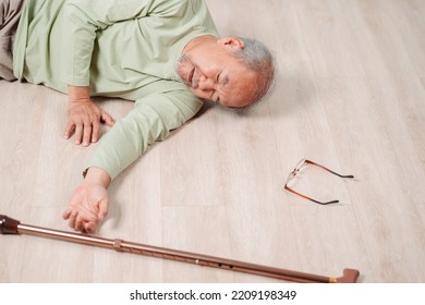 Asian Senior Man Falling On The Ground With Walker In Living Room At Home. Elderly Older Mature Male Having An Accident Heart Attack For Emergency Help Support From Hospital. Insurance Health Care.