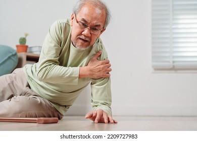 Asian Senior Man Falling On The Ground With Walker In Living Room At Home. Elderly Older Mature Male Having An Accident Heart Attack For Emergency Help Support From Hospital. Insurance Health Care.