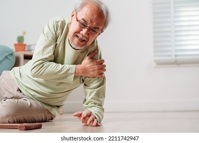 Asian Senior Man Falling On The Ground With Walker In Living Room At Home. Elderly Older Mature Male Having An Accident Heart Attack For Emergency Help Support From Hospital. Insurance Health Care.