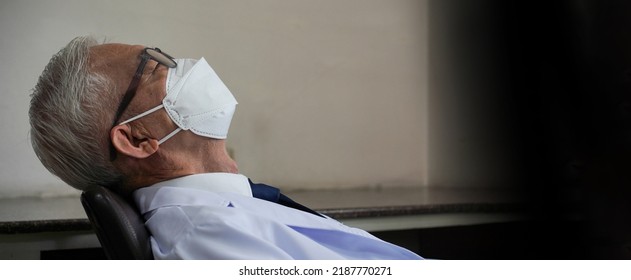 Asian Senior Man Overworked Stress Napping While Wearing Mask Tired From Work Hard