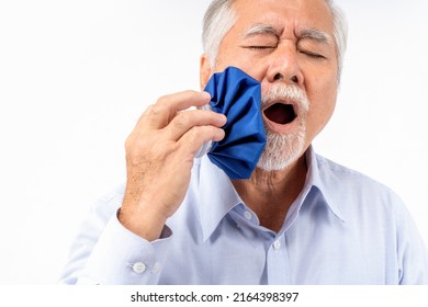 Asian Senior Man Pain In Tooth Ache, Mature Man Feeling Pain ,Old Elderly Male Suffering Having Painful Expression Toothache, Old Man Applying Ice Pack On Teeth, Health Problems.