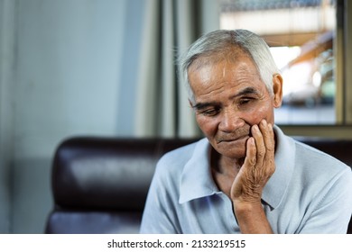 Asian Senior Man Patients Toothache While Hands On Cheek, Health Problem Retired Asian Old Man Hands Touching On Cheek While Pain A Toothache. Health Problem. Asian Older Man Suffering From Toothache.